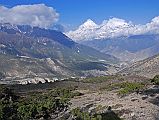 11 Dhaulagiri And Tukuche Peak Early Morning On Trail To Mesokanto La I turned around on the trail towards Mesokanto La and watched the clouds boil up towards Dhaulagiri and Tukuche Peak. The trail continues up the side of the valley from the kharka (3460m) and then splits in two � the left going to the Tilicho eastern pass (5200m), while we took the right path to try and cross the Mesokanto La (5100m).